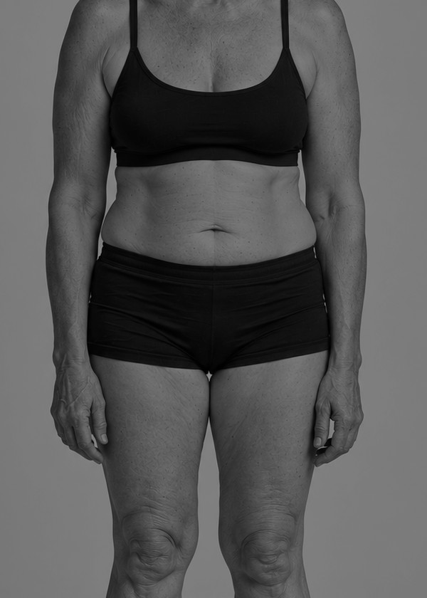 A woman facing forward, chest to thighs