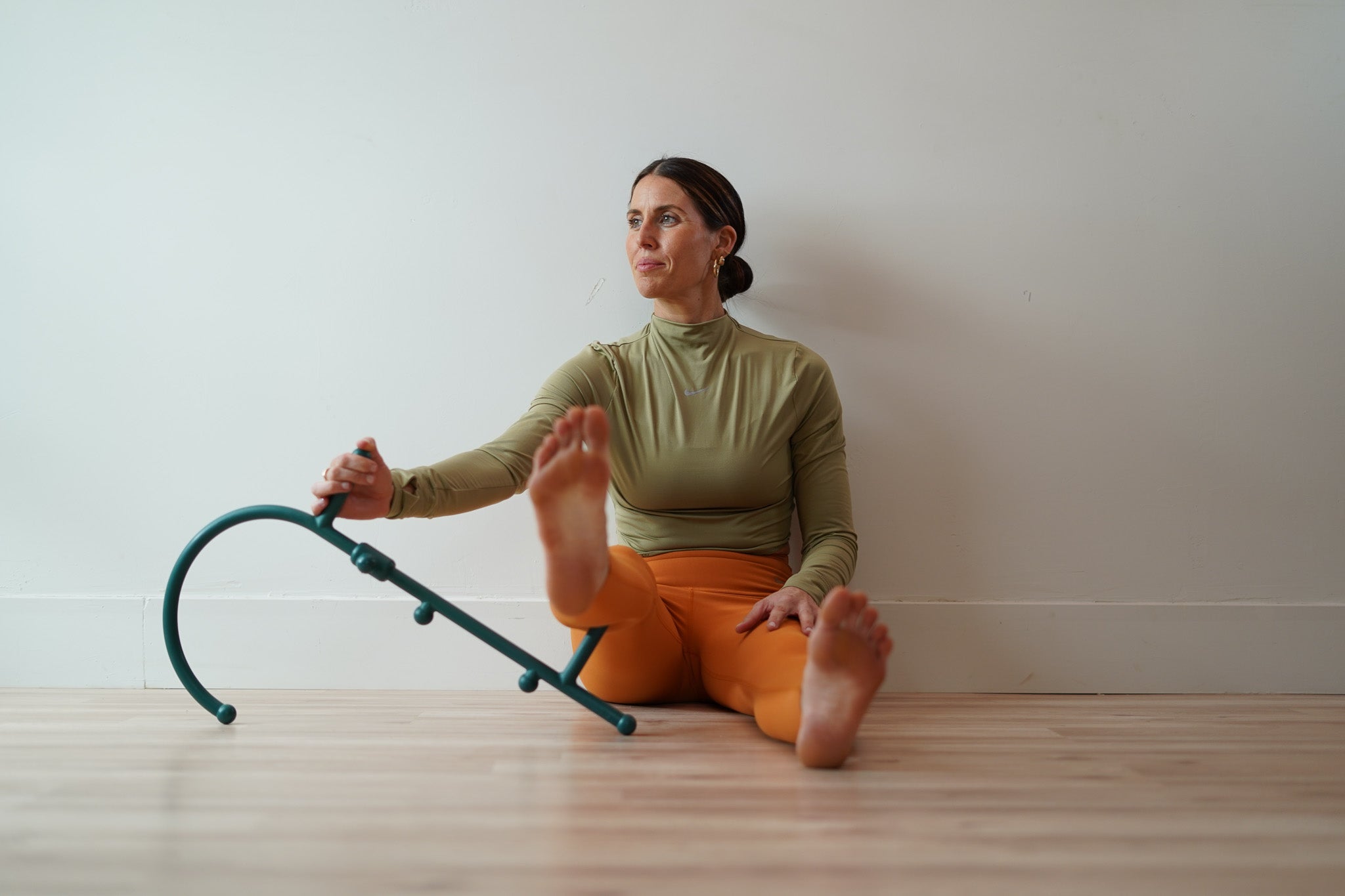 Fascia self-bodywork using a Theracane to release tension in the calf muscles.